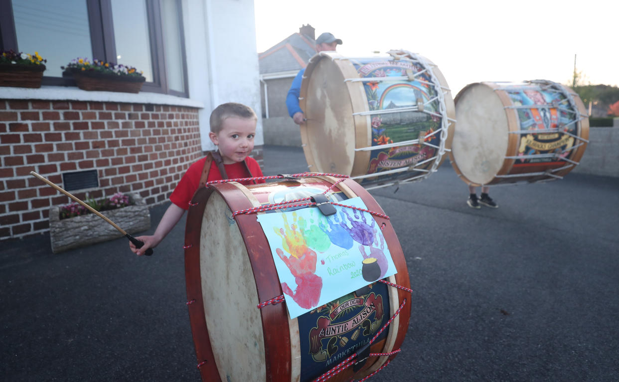 Boy bangs his drum