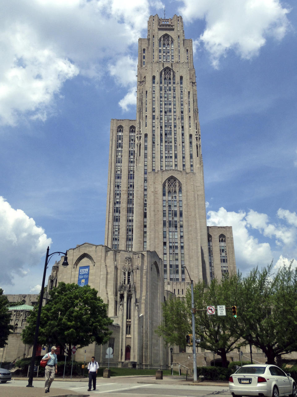 FILE- In this May 31, 2016, file photo the Cathedral of Learning, a landmark listed in the National Register of Historic Places, stands on the University of Pittsburgh's main campus in Pittsburgh. The University of Pittsburgh is offering graduating seniors up to $5,000 in federal student loan relief with one request: They pay it forward. The school’s new program, Panthers Forward, will help recent graduates chip away at student debt and introduce them to alumni mentors to encourage professional development. Students have no obligation to repay the gift, but the university is encouraging recipients to make financial contributions to sustain the program. (AP Photo/Bill Sikes, File)