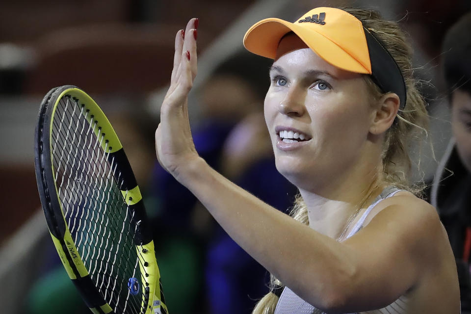 FILE - In this Friday, Oct. 4, 2019 file photo, Caroline Wozniacki of Denmark reacts after beating Daria Kasatkina of Russia in their quarterfinal match in the China Open tennis tournament in Beijing. Wozniacki has announced on Friday, Dec. 6, 2019 she will retire after the Australian Open. (AP Photo/Mark Schiefelbein, file)