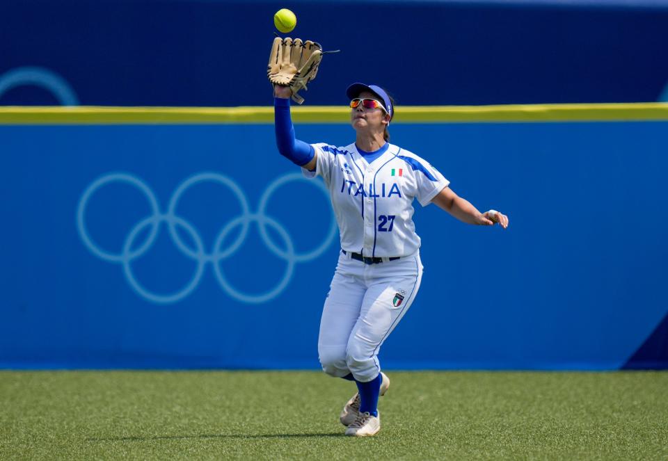 Italy's Giulia Koutsoyanopulos takes a catch during the softball game between Italy and the United States at the 2020 Summer Olympics, Wednesday, July 21, 2021, in Fukushima, Japan. (AP Photo/Jae C. Hong)
