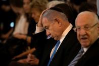 Israeli Prime Minister Benjamin Netanyahu takes part in a memorial ceremony held at the supreme court honouring former Supreme Court president Meir Shamgar who died on Saturday in Jerusalem