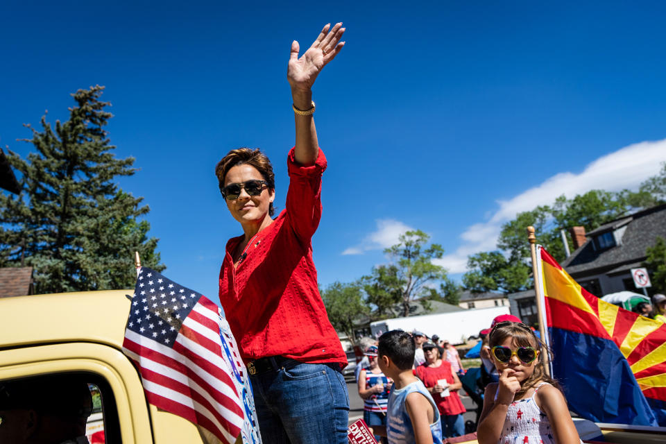 Kari Lake, Republican candidate for Governor of Arizona, waves at the Flagstaff Chamber of Commerce Fourth of July Parade in Flagstaff, Ariz., on July 4, 2022. (Bill Clark / CQ-Roll Call, Inc via Getty Images file)
