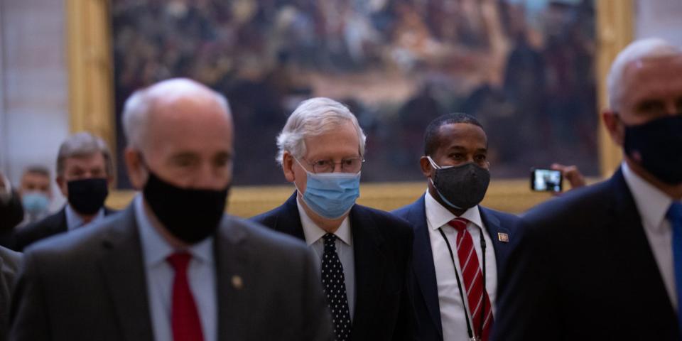 Sen. Mitch McConnell, then still the majority leader, walks through the Rotunda towards the House Chamber on January 6, 2021.