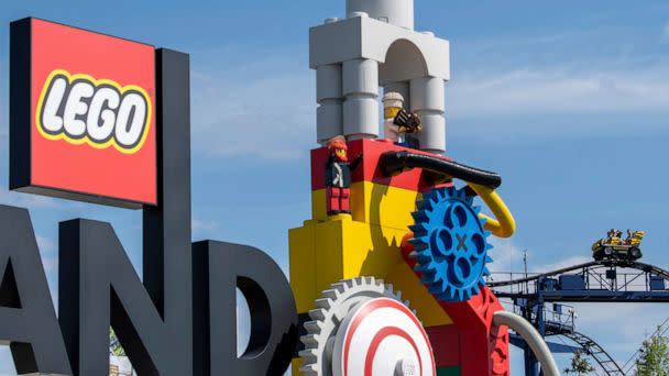 PHOTO:A roller coaster can be seen next to the logo at the entrance to the 'Legoland' amusement park in Guenzburg, southern Germany, Aug. 11, 2022.  (Stefan Puchner/DPA via AP)