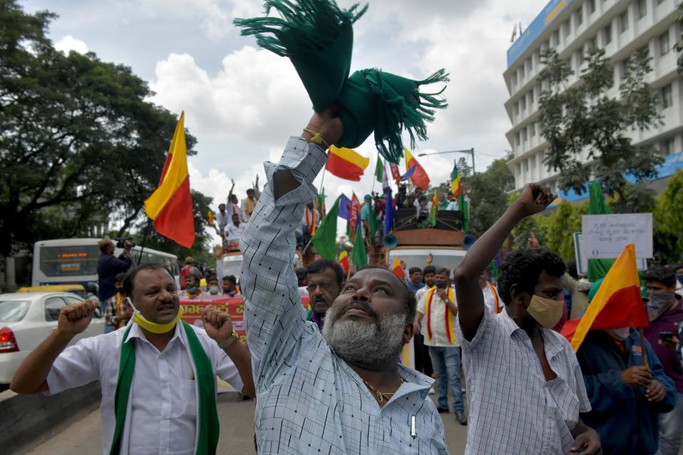 Activists belonging to various farmers rights organisations stage an anti-government demonstration to protest against the recent passing of new farm bills in parliament, in Bangalore on September 28, 2020. (Photo by Manjunath Kiran / AFP) (Photo by MANJUNATH KIRAN/AFP via Getty Images)