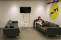 A Buzzfeed employee works at the company's headquarters in New York January 9, 2014. BuzzFeed has come a long way from cat lists. REUTERS/Brendan McDermid