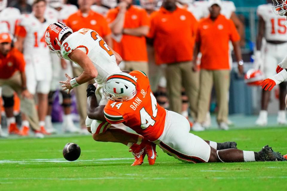 Miami Hurricanes defensive lineman Rueben Bain Jr. (44) sacks Clemson Tigers quarterback Cade Klubnik (2) during the second quarter at Hard Rock Stadium.