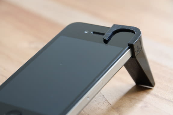 The iSPEX add-on mounts in front of a smartphone camera, turning the camera into an optical device that measures aerosol pollution.