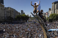 Argentine soccer fans celebrate their team's World Cup victory over France, in Buenos Aires, Argentina, Sunday, Dec. 18, 2022. (AP Photo/Rodrigo Abd)