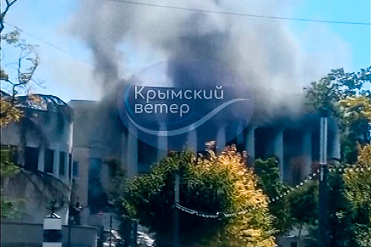 Smoke rises over the Headquarters of Russia's Black Sea Fleet in Sevastopol, Crimea, following a missile strike on Friday in which Ukraine claimed two senior commanders were injured (AP)