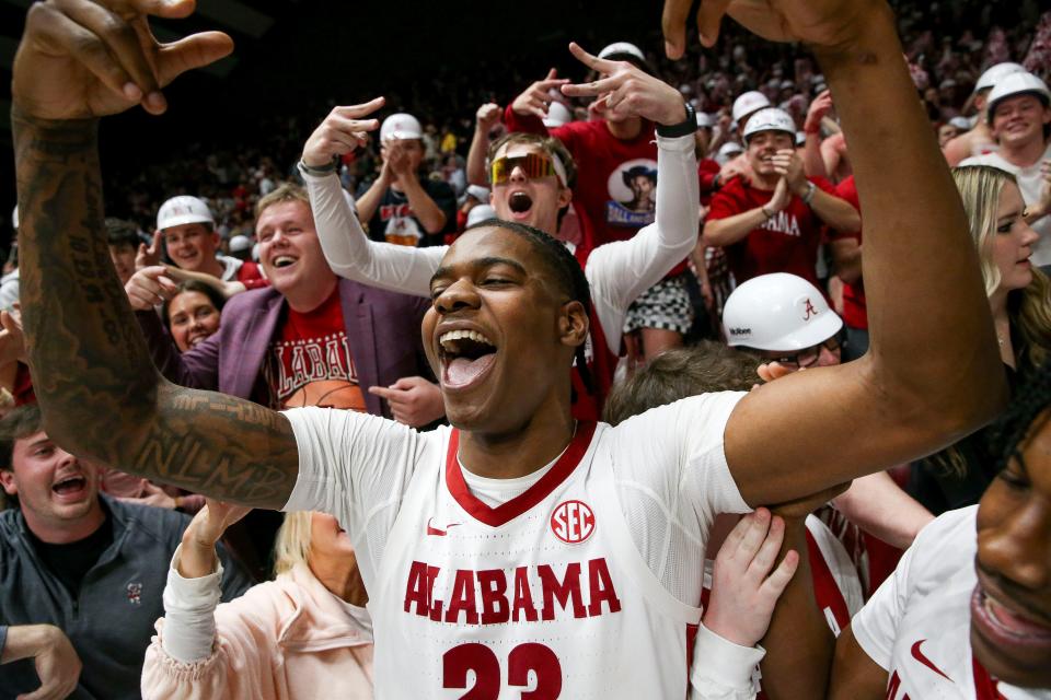 Jan 24, 2024; Tuscaloosa, Alabama, USA; Alabama forward Nick Pringle (23) celebrates with fans at Coleman Coliseum. Alabama upset 8th ranked Auburn 79-75. Mandatory Credit: Gary Cosby Jr.-USA TODAY Sports