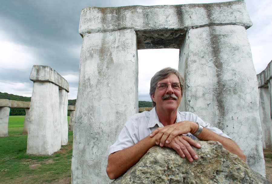 Doug Hill poses for a photo with Stonehenge II, Thursday, July 22, 2010, in Hunt, Texas. The Stonehenge replica, built by Doug Hill and Al Shepperd in 1989, was moved to a new home in Ingram shortly after the photo was taken. (AP Photo/Eric Gay)