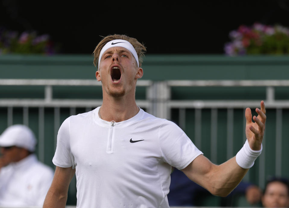 Canada's Denis Shapovalov reacts as he plays Brandon Nakashima of the US in a second round men's single match on day four of the Wimbledon tennis championships in London, Thursday, June 30, 2022. (AP Photo/Alastair Grant)