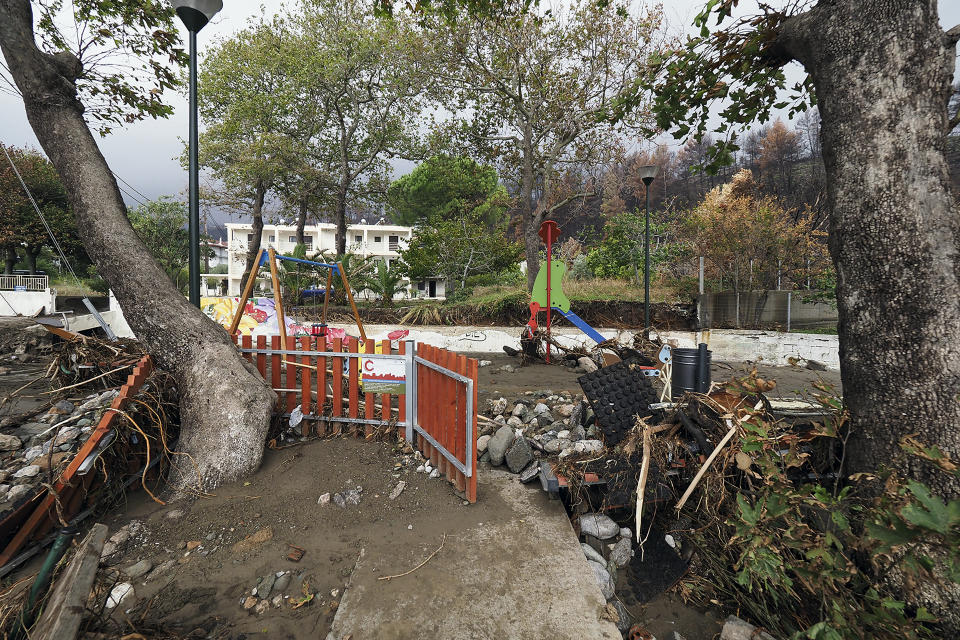 A destroyed playground is pictured at Achladi village following a flood on the northern part of Evia island, Greece, Sunday, Oct. 10, 2021. The wildfires that destroyed a third of the island's forests in early August have loosened the topsoil and several communities are at risk from flooding. (AP Photo/Thodoris Nikolaou)