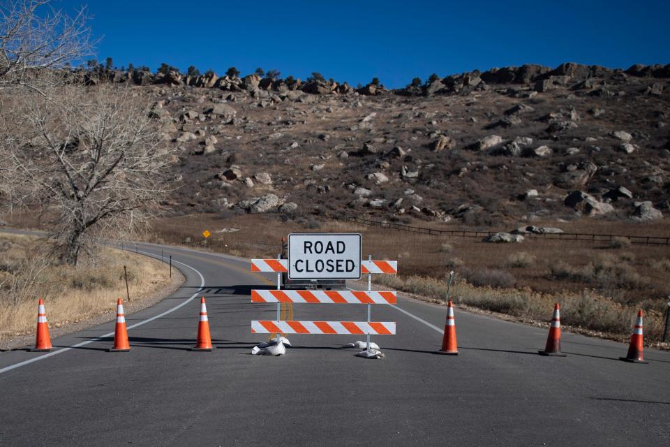 A section of West County Road 38 East remains closed by Stout Wilds Road as crews work to fix a down utility line on Thursday, Dec. 16, 2021, along the southeastern edge of Horsetooth Reservoir.