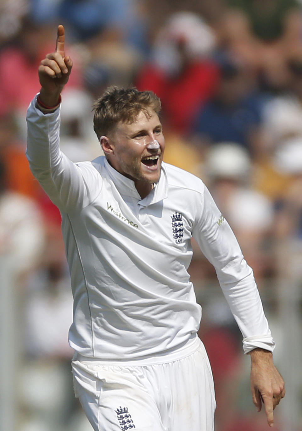 England's bowler Joe Root celebrates the wicket of Indian batsman Parthiv Patel on the third day of the fourth cricket test match between India and England in Mumbai, India, Saturday, Dec. 10, 2016. (AP Photo/Rafiq Maqbool)