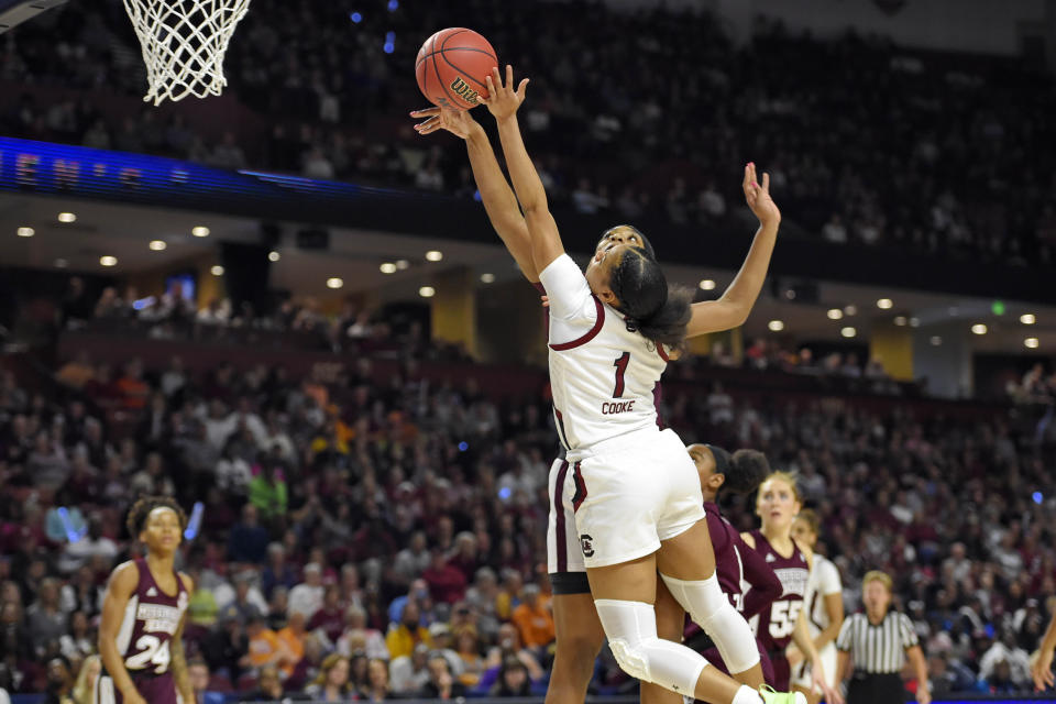 South Carolina's Zia Cooke (1) shoots while defended by Mississippi State's Jessika Carter, back, during a championship match at the Southeastern Conference women's NCAA college basketball tournament in Greenville, S.C., Sunday, March 8, 2020. (AP Photo/Richard Shiro)