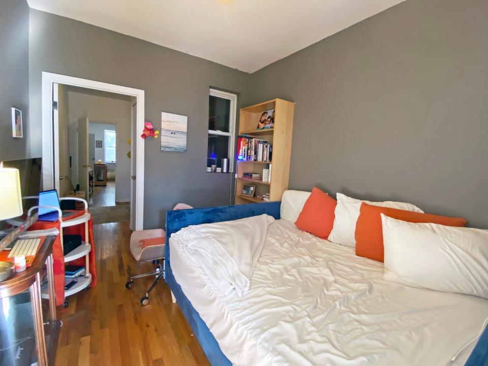 The author's office is seen with a daybed on the right and a desk on the left.