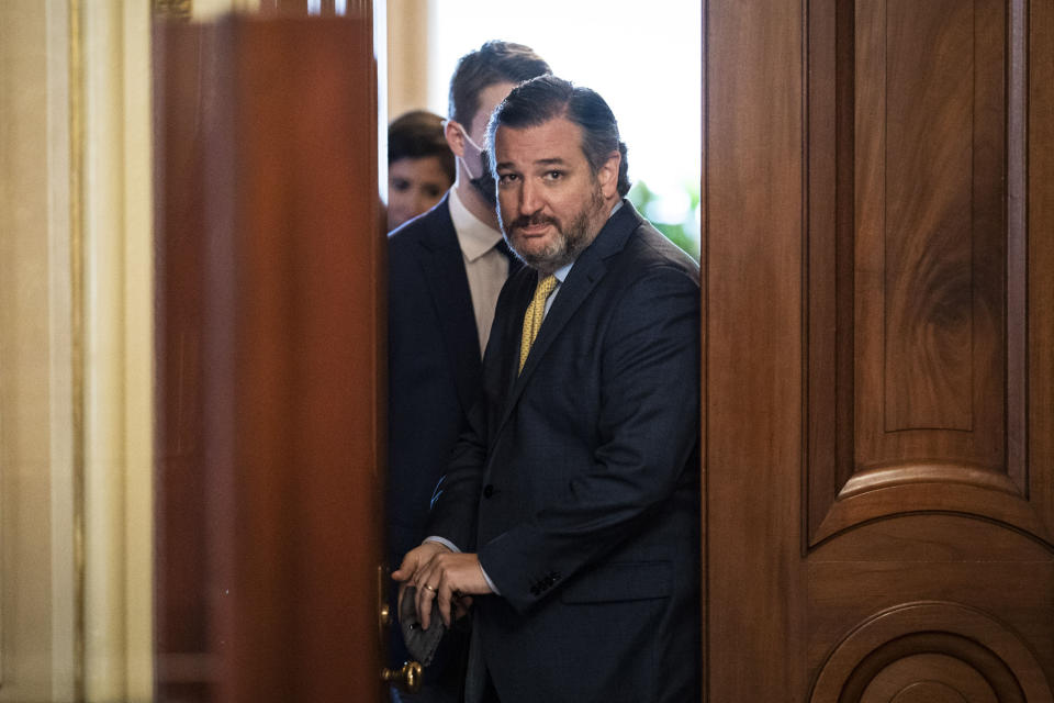 Ted Cruz walks out of a meeting room for the lawyers of former president Donald Trump and back to the Senate floor through the Senate Reception room on the fourth day of the Senate Impeachment trials for former President Donald Trump on Capitol Hill, Friday, February 12, 2021 in Washington.