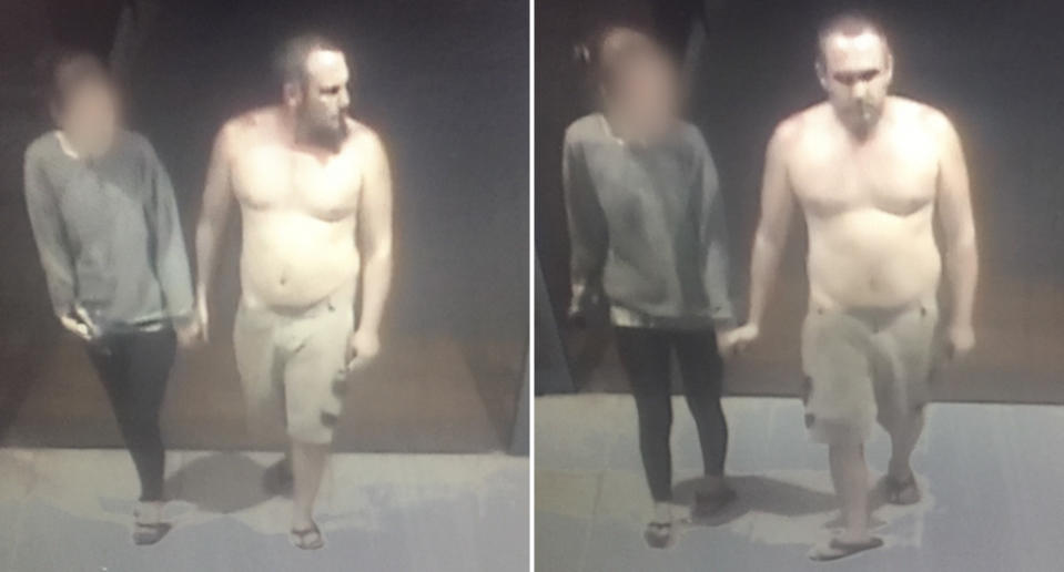 A man is seen shirtless walking into a supermarket.