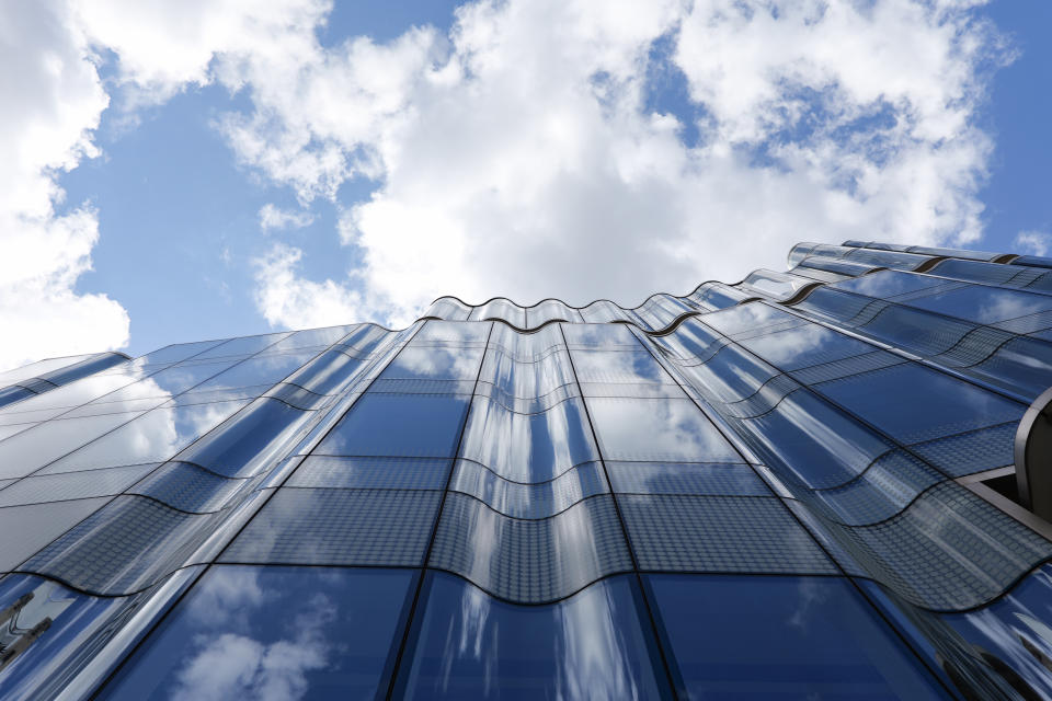 Glass building reflecting the sky