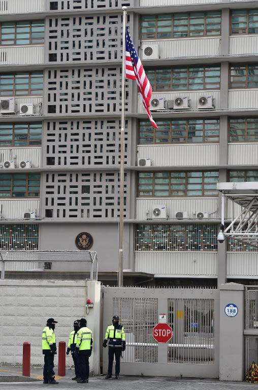 South Korean police stand guard outside the US embassy in Seoul on March 5, 2015, after US ambassador to South Korea, Mark Lippert, was attacked