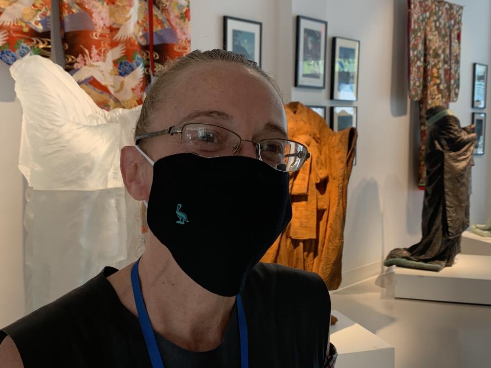 Imagine Museum employee displays masks they handed out for free on June 9. They are currently out of free masks but do have a new supply coming in, said the city. (Photo by Skyla Luckey | Patch)