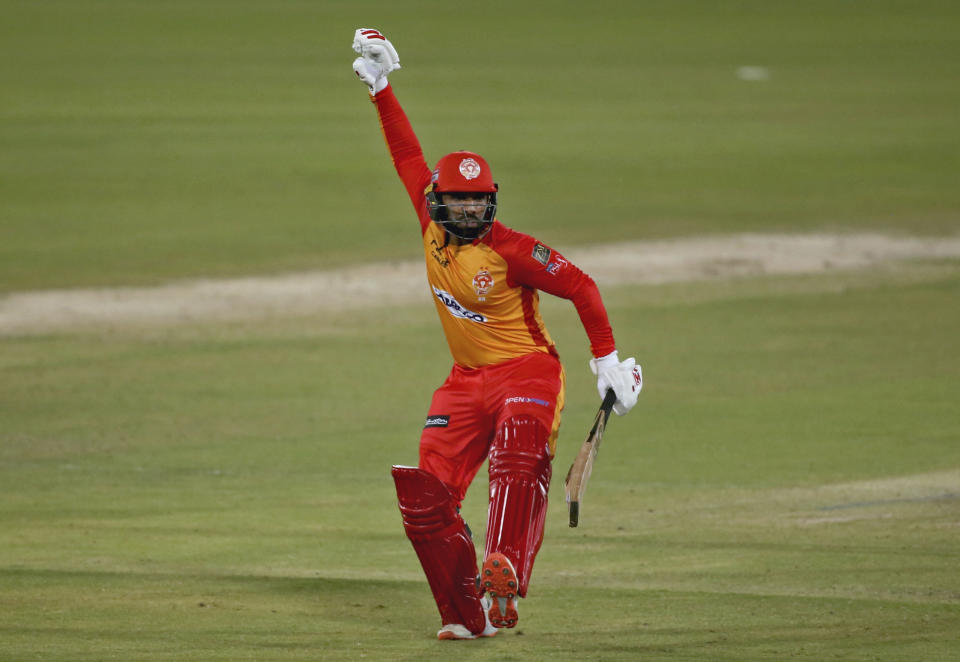 Islamabad United Asif Ali celebrates after playing winning shot during a Pakistan Super League T20 cricket match between Karachi Kings and Islamabad United at the National Stadium, in Karachi, Pakistan, Wednesday, Feb. 24, 2021. (AP Photo/Fareed Khan)