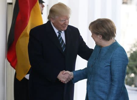 President Trump welcomes German Chancellor Angela Merkel at the White House. REUTERS/Jim Bourg