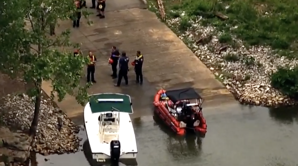 Two boats and search officials at Percy Priest Lake following the plane crash.