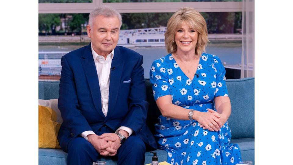 Eamonn Holmes looking glum while sat with a smiling Ruth Langsford