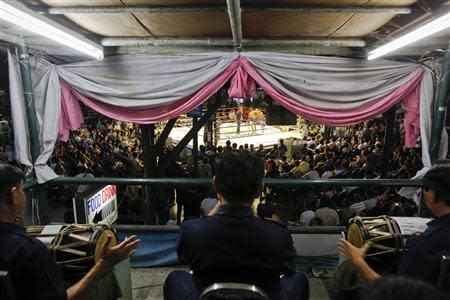 Live music is being performed during the closing Thai boxing, or "Muay Thai", fight night of the legendary Lumpinee stadium, one of Bangkok's oldest boxing venues which is being demolished after 57 years, February 7, 2014. REUTERS/Damir Sagolj