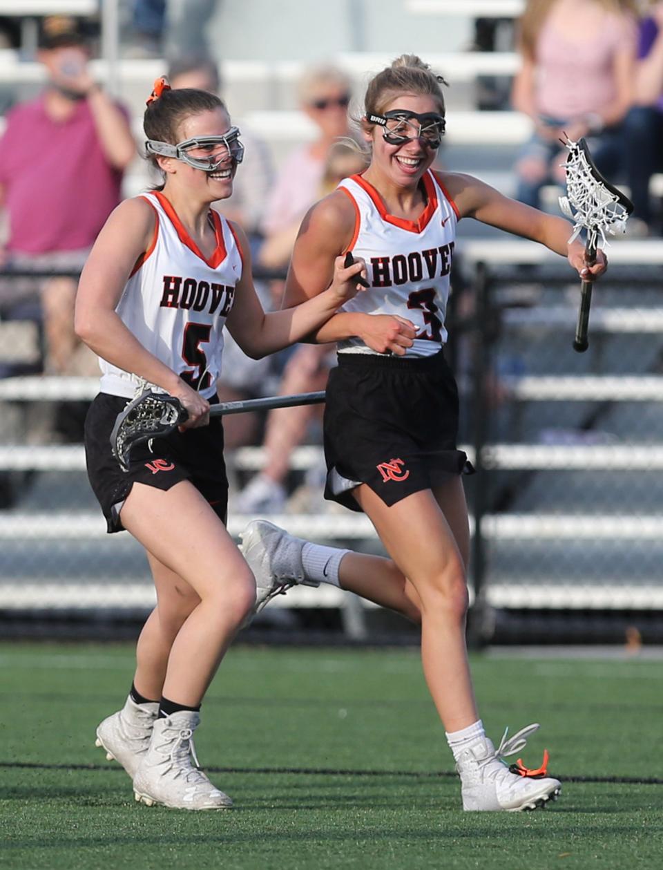 Lily Cain (3) of Hoover celebrates her goal with Lilly Altman (5) during their game against Jackson at Hoover on Tuesday, April 27, 2021.