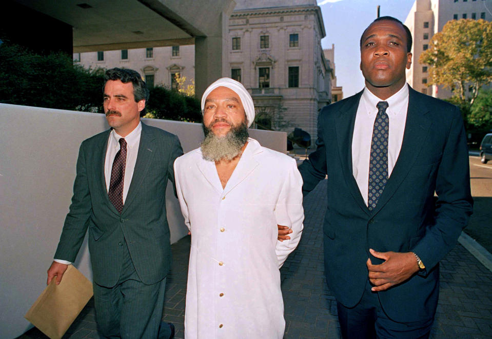 Hulon Mitchell Jr., also known as Yahweh ben Yahweh, is led into the federal court house in New Orleans by FBI agents, Nov. 7, 1990. (Photo: Bill Haber/AP)