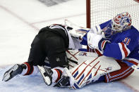 New York Rangers goaltender Igor Shesterkin hits New Jersey Devils right wing Timo Meier in the second period of Game 3 of the team's NHL hockey Stanley Cup first-round playoff series Saturday, April 22, 2023, in New York. (AP Photo/Adam Hunger)