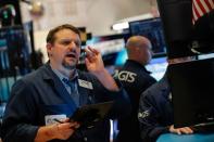 Traders work on the floor of the NYSE in New York