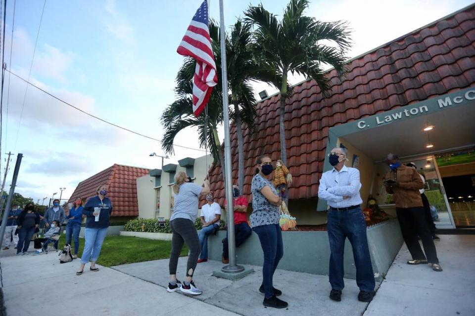 Voters lined up before doors opened at 7 a.m. Tuesday, Nov. 3, 2020, at the C . Lawton McCall Community Center in Miami Shores. 