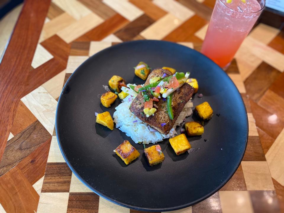 Mahi mahi over coconut rice with butternut squash and pineapple jicama salsa at Good Fellows 501 in Woodbine.