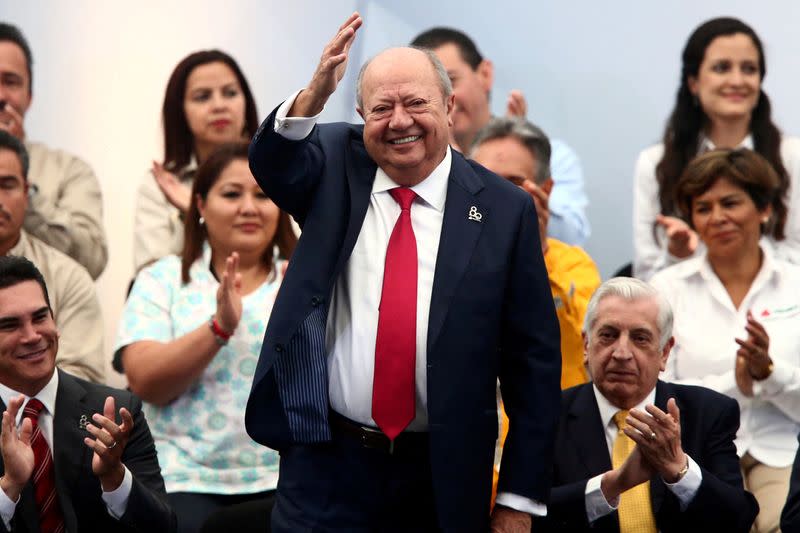 FILE PHOTO: Carlos Romero Deschamps, leader of the oil workers union of Pemex, waves during the 80th anniversary of the expropriation of Mexico's oil industry in Mexico City