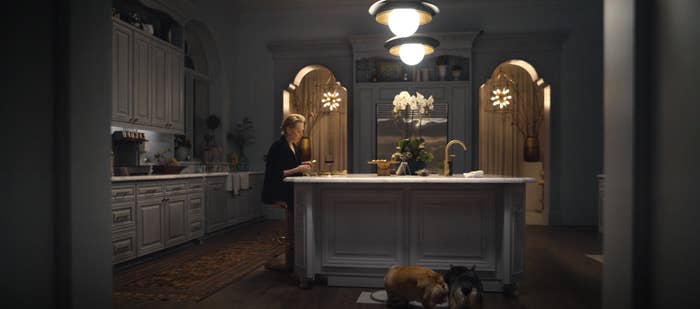 Jean Smart as Deborah Vance eats alone in her very large kitchen in "Hacks"