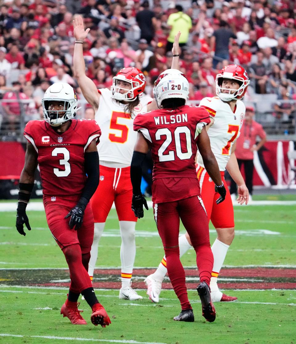 Sep 11, 2022; Glendale, Arizona, USA; Kansas City Chiefs place kicker Harrison Butker (7) makes a field goal as holder Tommy Townsend (5) celebrates against Arizona Cardinals safety Budda Baker (3) and cornerback Marco Wilson (20) in the first half of the season opener at State Farm Stadium.