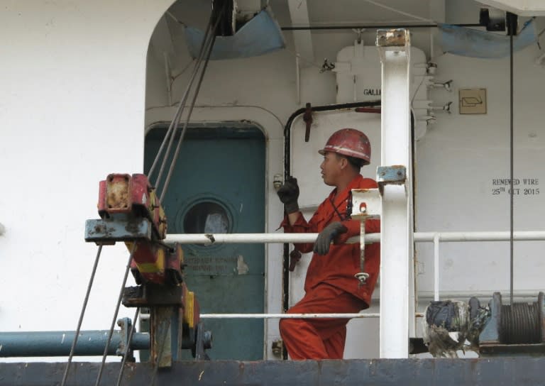 A member of the crew of the North Korean cargo ship Jin Teng, anchored at the former US naval base at Subic port, north of Manila, seen on deck of the ship on March 4, 2016