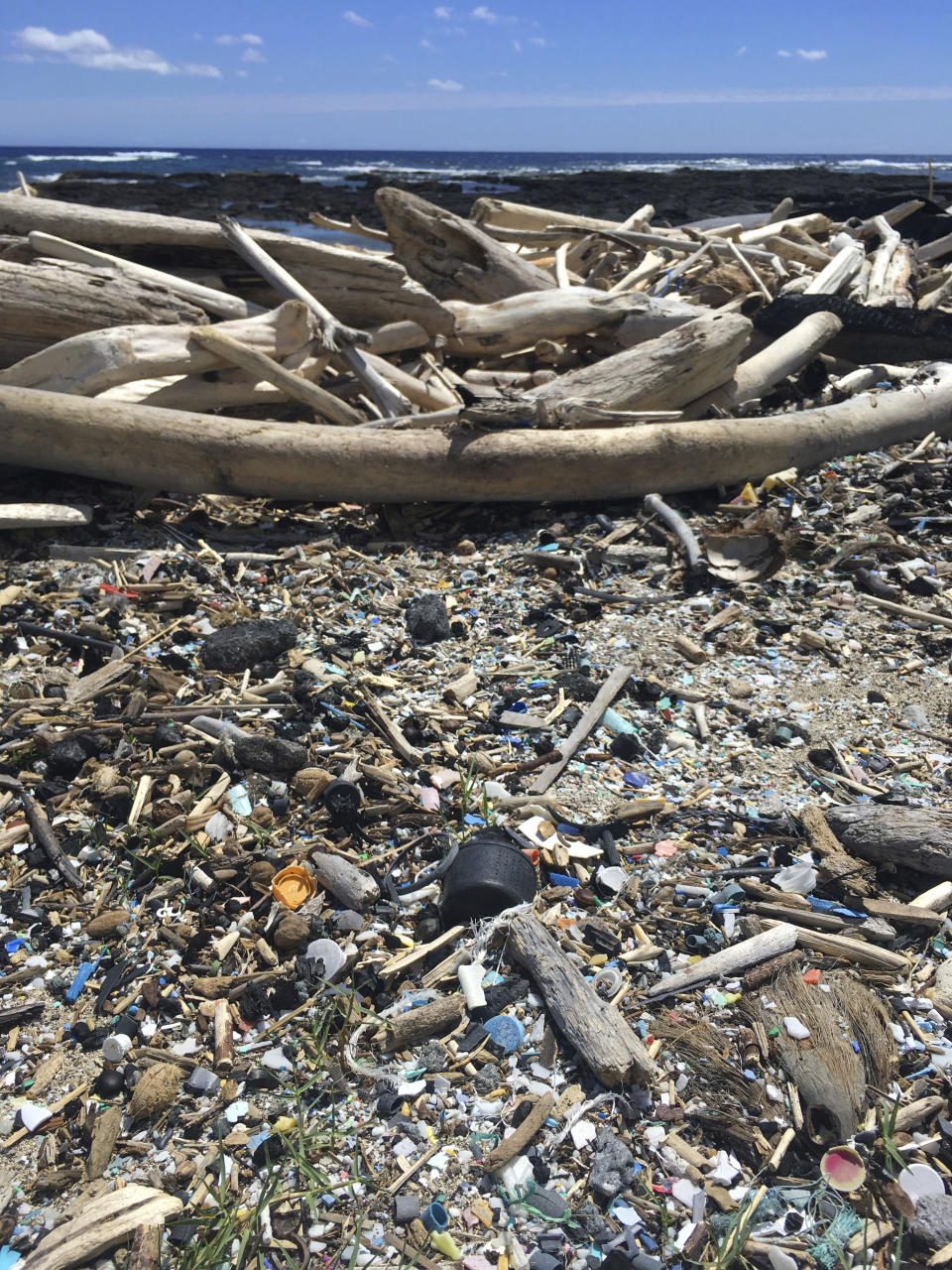 This March, 2019 photo provided by the Hawaii Wildlife Fund shows the beach at Kamilo Point in Naalehu, Hawaii. The U.S. Environmental Protection Agency has designated the waters of two remote beaches in Hawaii as being contaminated by trash, forcing the state to address the persistent problem of plastic deposited on its coastlines by swirling Pacific Ocean currents. (Megan Lamson, Hawaii Wildlife Fund via AP)