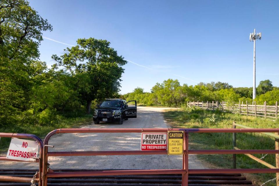 Law enforcement vehicles block the entrance to a grid search conducted by local police and Texas Search and Rescue on Saturday, April 22, 2023, in Everman, Texas. After his mother fled the country in March, police revealed Noel had not been seen since November 2022.