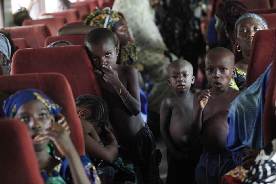 In this Photo taken, Friday, March . 8, 2013, children sit on board an Ooni of Ife train to Kano, Nigeria. Nigeria reopened its train line to the north Dec. 21, marking the end of a $166 million project to rebuild portions of the abandoned line washed out years earlier. The state-owned China Civil Engineering Construction Corp. rebuilt the southern portion of the line, while a Nigerian company handled the rest. The rebirth of the lines constitutes a major economic relief to the poor who want to travel in a country where most earn less than $1 a day. Airline tickets remain out of the reach of many and journeys over the nation's crumbling road network can be dangerous. The cheapest train ticket available costs only $13. ( AP Photo/Sunday Alamba)