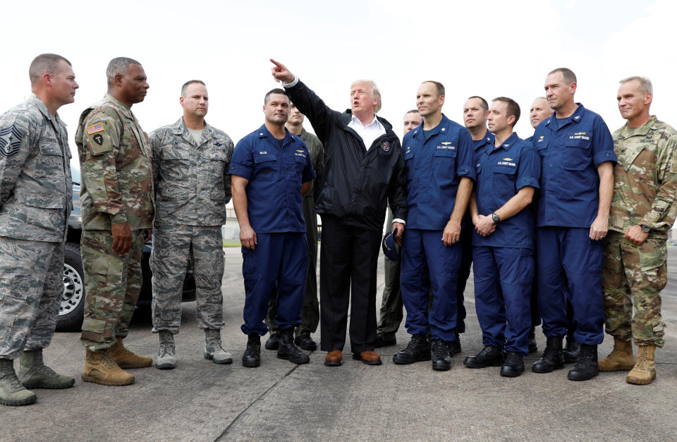 <p>President Donald Trump speaks with troops and members of the United States Coast Guard at Ellington Field after meeting with flood survivors and volunteers who assisted in relief efforts in the aftermath of Hurricane Harvey, in Houston, Texas, Sept. 2, 2017. (Photo: Kevin Lamarque/Reuters) </p>