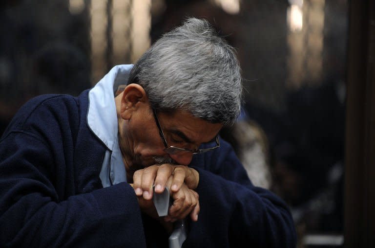 Retired general Jose Rodriguez reacts during a court hearing in Guatemala City on January 28, 2013. A judge decided to open a genocide trial against Rodriguez, a former member of the military leadership who arrived in court in a wheelchair