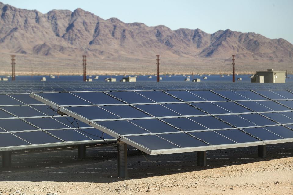 Solar panels produce energy at the Desert Sunlight Energy Center near Desert Center, Calif., on Dec. 19, 2019.