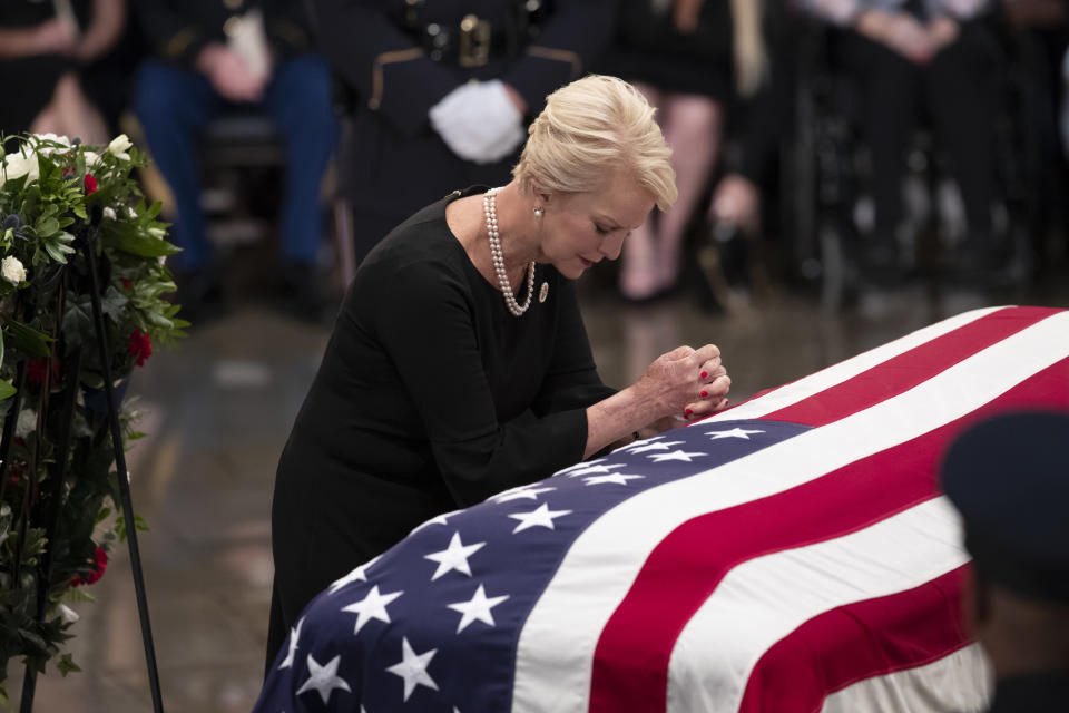 Cindy McCain, wife of Sen. John McCain, R-Ariz., leans on his flag-draped casket during a farewell ceremony in the U.S. Capitol rotunda, Friday, Aug. 31, 2018, in Washington. McCain was a six-term senator, a former Republican nominee for president, and a Navy pilot who served in Vietnam, where he endured five-and-a-half years as a prisoner of war. He died Aug. 25 from brain cancer at age 81. (AP Photo/J. Scott Applewhite)