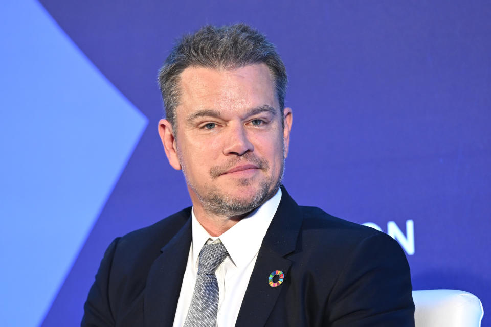 Close-up of Matt wearing a suit and tie at a media event